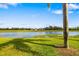Backyard view of the pond with a fountain at 923 Fairwaycove Ln # 103, Bradenton, FL 34212