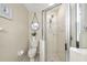 Bathroom displaying a toilet, walk-in shower and a decorative mirror at 923 Fairwaycove Ln # 103, Bradenton, FL 34212