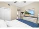 Bedroom featuring a TV, bed and a large dresser with storage at 923 Fairwaycove Ln # 103, Bradenton, FL 34212