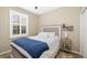 Bedroom featuring a bed, window with shutters and a side table at 923 Fairwaycove Ln # 103, Bradenton, FL 34212