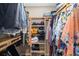 Walk-in closet with lots of clothing, shelving and room for storage at 923 Fairwaycove Ln # 103, Bradenton, FL 34212