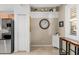 Dining area with a decorative shelf and a window with shutters near the kitchen at 923 Fairwaycove Ln # 103, Bradenton, FL 34212