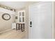 Entryway leading to a light-filled dining area with a window with shutters at 923 Fairwaycove Ln # 103, Bradenton, FL 34212