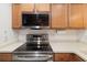 Updated kitchen features stainless steel appliances and light countertops at 923 Fairwaycove Ln # 103, Bradenton, FL 34212
