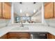 The kitchen has stainless steel appliances with a view into the living room at 923 Fairwaycove Ln # 103, Bradenton, FL 34212