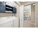 Laundry room with washer, dryer, cabinets and storage for household items at 923 Fairwaycove Ln # 103, Bradenton, FL 34212