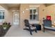 Charming condo patio with Adirondack chairs creating a cozy and inviting outdoor space at 923 Fairwaycove Ln # 103, Bradenton, FL 34212