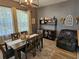 Bright dining room features modern lighting, dining table with seating for six and built in shelving at 1155 Millbrook Cir, Bradenton, FL 34212