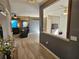 Open-concept living space with hardwood floors, neutral paint, and ample natural light from the windows at 1155 Millbrook Cir, Bradenton, FL 34212