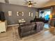 Cozy living room featuring hardwood floors, neutral decor, and comfortable seating arrangements at 1155 Millbrook Cir, Bradenton, FL 34212