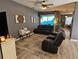 Comfortable living room with plush seating, stylish decor, and a ceiling fan for added comfort at 1155 Millbrook Cir, Bradenton, FL 34212