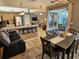 Open concept living space with a kitchen, dining area, and living room provides ample space for all at 1155 Millbrook Cir, Bradenton, FL 34212