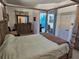 Large main bedroom with ensuite bathroom and sliding glass door access to outdoor space at 1155 Millbrook Cir, Bradenton, FL 34212