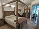 Spacious main bedroom with ensuite bathroom and sliding glass door access to an outdoor lounge at 1155 Millbrook Cir, Bradenton, FL 34212