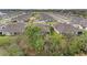 Aerial view of backyard and neighboring homes in a well maintained neighborhood at 12476 Oak Hill Way, Parrish, FL 34219