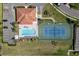 Aerial shot showcasing a community pool, tennis court, parking, and well-maintained landscaping at 1318 3Rd Street E Cir, Palmetto, FL 34221