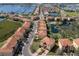 Panoramic aerial showcasing the waterfront community with homes, a tranquil pond, and boat docks at 1318 3Rd Street E Cir, Palmetto, FL 34221