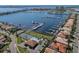 Stunning aerial view of a waterfront community with marina, tennis court, and pool at 1318 3Rd Street E Cir, Palmetto, FL 34221