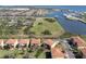 Sweeping aerial capturing a waterfront community with homes, marina, and picturesque waterfront views at 1318 3Rd Street E Cir, Palmetto, FL 34221