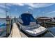 Docked Regal boat showing the stern with blue cover under a blue sky at 1318 3Rd Street E Cir, Palmetto, FL 34221