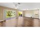 Spacious living room features wood floors and sliding doors to outdoor patio at 1318 3Rd Street E Cir, Palmetto, FL 34221