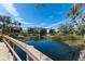 Scenic view of a community pond on a clear day with homes in the background at 1318 3Rd Street E Cir, Palmetto, FL 34221