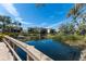 Beautiful view of the pond and landscaping from the bridge in the community at 1318 3Rd Street E Cir, Palmetto, FL 34221