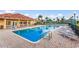 A large community pool surrounded by lounge chairs offers a relaxing atmosphere at 1318 3Rd Street E Cir, Palmetto, FL 34221
