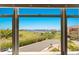 Window view of lake, trees and a sunny sky at 1318 3Rd Street E Cir, Palmetto, FL 34221