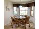 Bright breakfast nook with a glass table and comfortable seating for four at 1428 Pine Island Ct, Punta Gorda, FL 33950