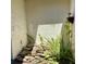 Courtyard featuring a rock garden with lush tropical plants and natural sunlight at 1428 Pine Island Ct, Punta Gorda, FL 33950