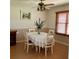 Charming dining room with a wood window, an elegant table, and classic decor at 1428 Pine Island Ct, Punta Gorda, FL 33950