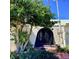 Front exterior shot showcasing unique architectural details and lush greenery at 1428 Pine Island Ct, Punta Gorda, FL 33950