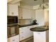 Well-equipped kitchen with stainless steel appliances, granite counters, and ample cabinet space at 1428 Pine Island Ct, Punta Gorda, FL 33950