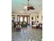 Cozy living room featuring stylish seating, tile flooring, and unique decor at 1428 Pine Island Ct, Punta Gorda, FL 33950