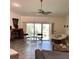 Inviting living room with a fireplace and sliding glass doors leading to the outdoors at 1428 Pine Island Ct, Punta Gorda, FL 33950