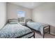 Bedroom featuring two beds with matching bedding and simple decor at 1524 Remington Trace Dr, Port Charlotte, FL 33953