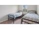 Bedroom featuring two beds with matching bedding and simple decor at 1524 Remington Trace Dr, Port Charlotte, FL 33953