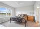 Cozy bedroom features carpet floors, a window overlooking a scenic lake, and an attached bathroom at 1524 Remington Trace Dr, Port Charlotte, FL 33953