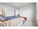 Bedroom boasts neutral colors, a ceiling fan, soft carpet, and easy access to an ensuite bathroom at 1524 Remington Trace Dr, Port Charlotte, FL 33953