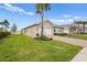 Well-maintained home with lush green lawn and inviting landscaping at 1524 Remington Trace Dr, Port Charlotte, FL 33953