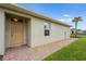 Home exterior featuring a welcoming front door and well-kept landscaping at 1524 Remington Trace Dr, Port Charlotte, FL 33953