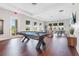 Spacious game room featuring a pool table and comfortable seating areas at 1524 Remington Trace Dr, Port Charlotte, FL 33953