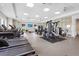 Well-equipped gym with treadmills, weights, and a functional layout for diverse exercise routines at 1524 Remington Trace Dr, Port Charlotte, FL 33953