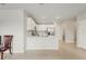 Open kitchen with stainless steel appliances, white cabinetry and quartz countertops at 1524 Remington Trace Dr, Port Charlotte, FL 33953