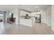 Modern kitchen with white cabinets, stainless steel appliances, and an open floor plan at 1524 Remington Trace Dr, Port Charlotte, FL 33953