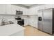 Spacious kitchen with stainless steel appliances, white cabinets, and generous countertop space at 1524 Remington Trace Dr, Port Charlotte, FL 33953