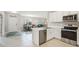 Stylish kitchen showcasing stainless steel appliances and a view of the dining and living areas at 1524 Remington Trace Dr, Port Charlotte, FL 33953