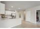 Clean kitchen featuring white cabinets, stainless steel appliances, and a spacious countertop at 1524 Remington Trace Dr, Port Charlotte, FL 33953