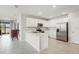 Modern kitchen featuring stainless steel appliances, sleek white cabinets and a breakfast bar at 1524 Remington Trace Dr, Port Charlotte, FL 33953